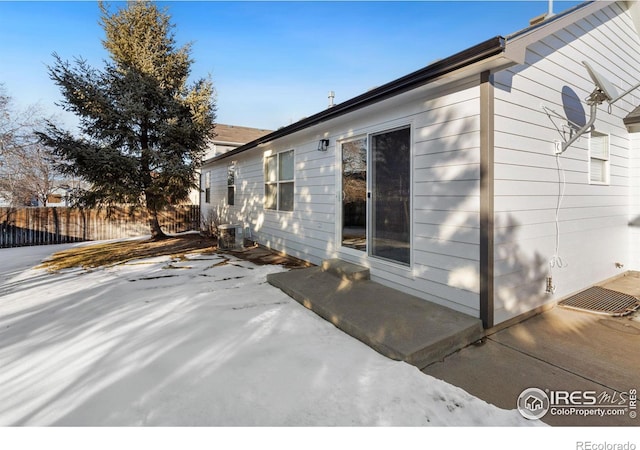 view of side of home featuring a patio and cooling unit