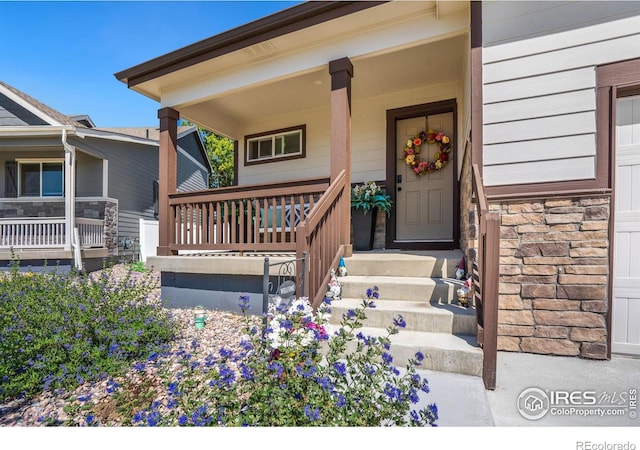 doorway to property with covered porch