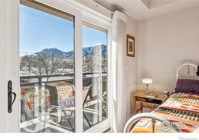 bedroom featuring a mountain view