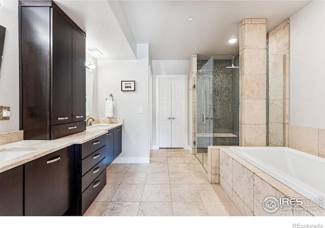 bathroom with vanity and separate shower and tub