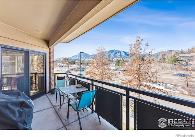 balcony with grilling area and a mountain view