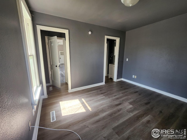 unfurnished bedroom with wood-type flooring