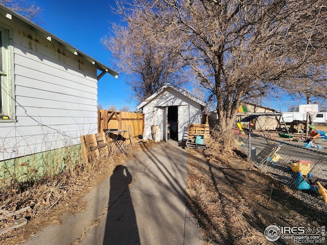 exterior space with a shed