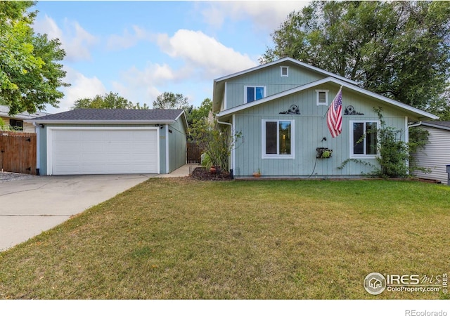 view of front of house featuring a garage and a front lawn