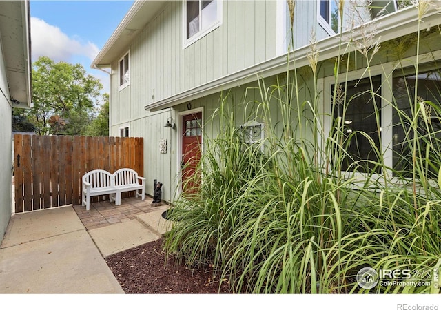 doorway to property with a patio