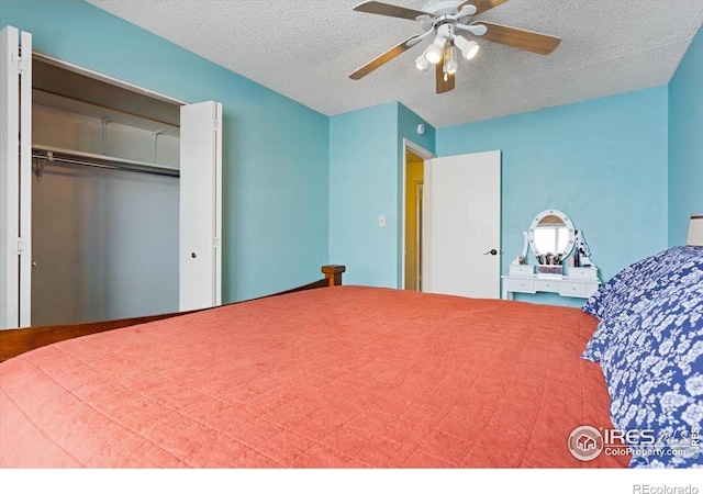 unfurnished bedroom with a textured ceiling, a closet, and ceiling fan