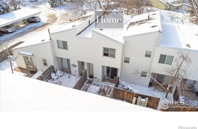 view of snow covered property