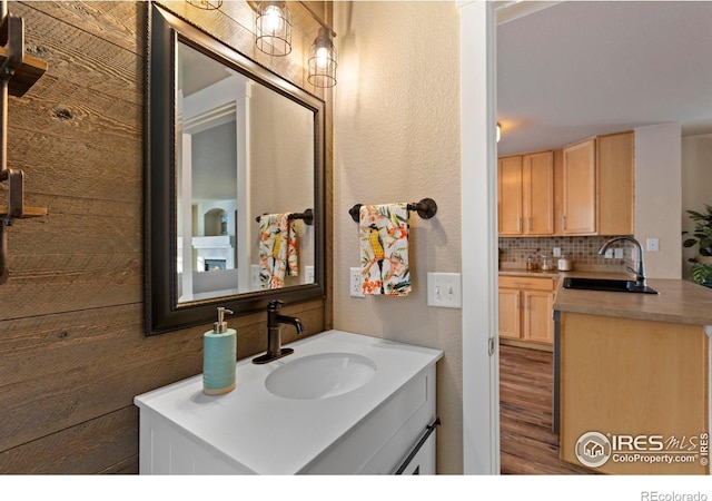 bathroom featuring tasteful backsplash and vanity