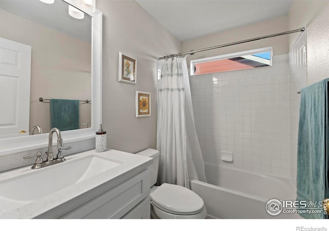 full bathroom featuring toilet, vanity, and shower / bathtub combination with curtain