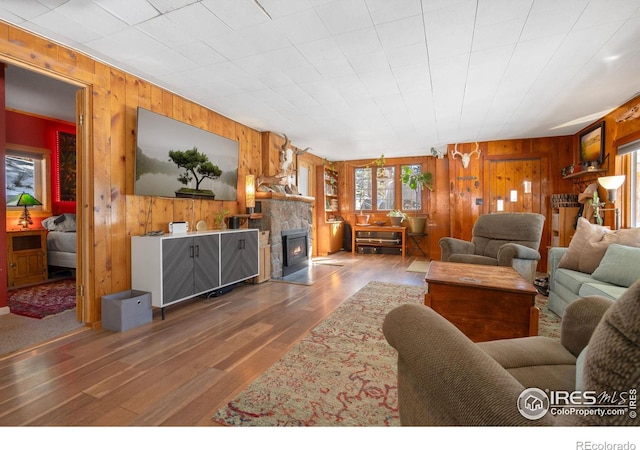 living room featuring hardwood / wood-style flooring and a fireplace