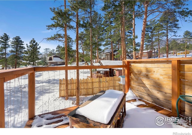 view of snow covered deck