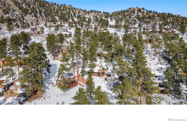 snowy aerial view featuring a mountain view