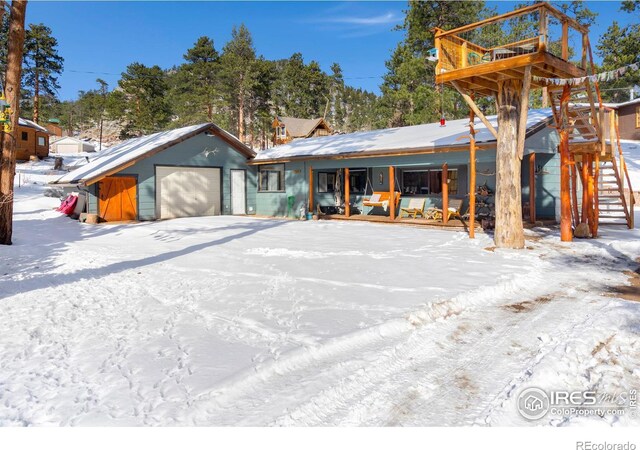 view of front of house with a porch and an attached garage