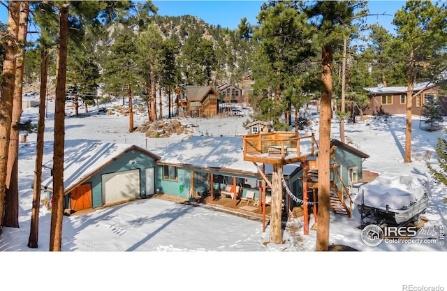 chalet / cabin featuring an attached garage