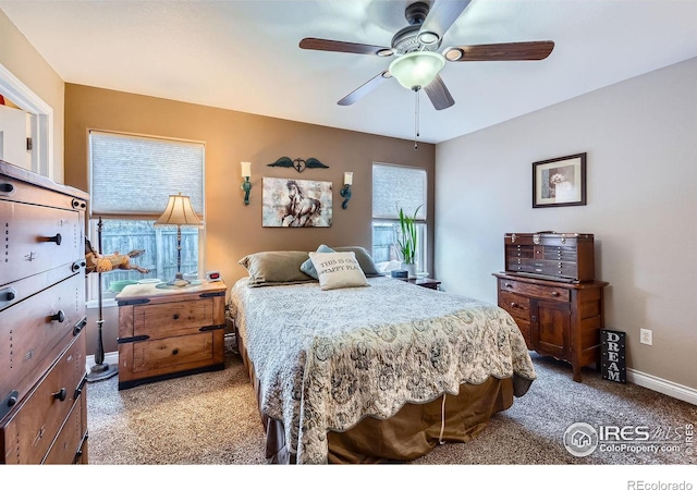 bedroom with light colored carpet and ceiling fan