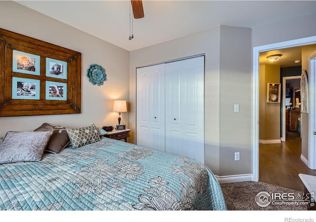 bedroom featuring ceiling fan, dark carpet, and a closet