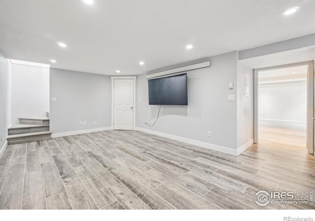 basement featuring light hardwood / wood-style floors