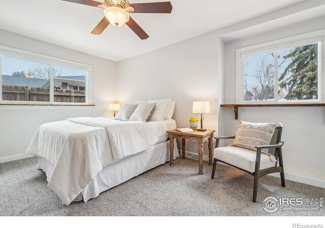 bedroom featuring ceiling fan and carpet