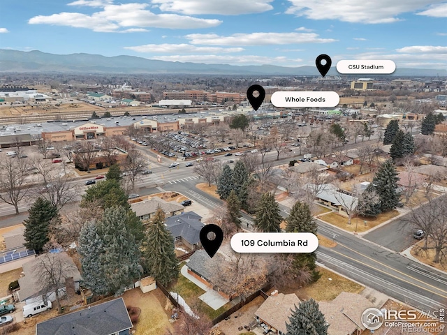 birds eye view of property with a mountain view