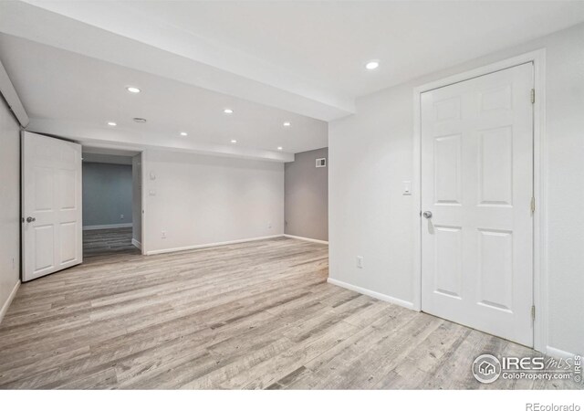 empty room with light wood-type flooring