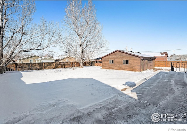 view of yard covered in snow