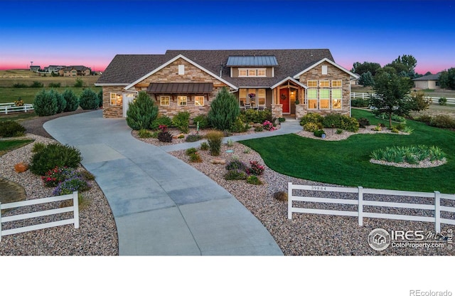 craftsman-style house featuring a porch and a yard