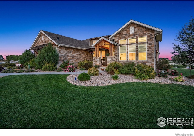 view of front of house featuring a porch and a yard