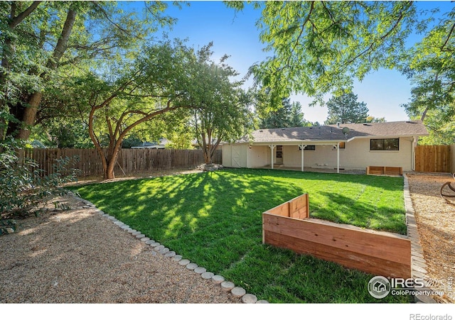 view of yard featuring a fenced backyard