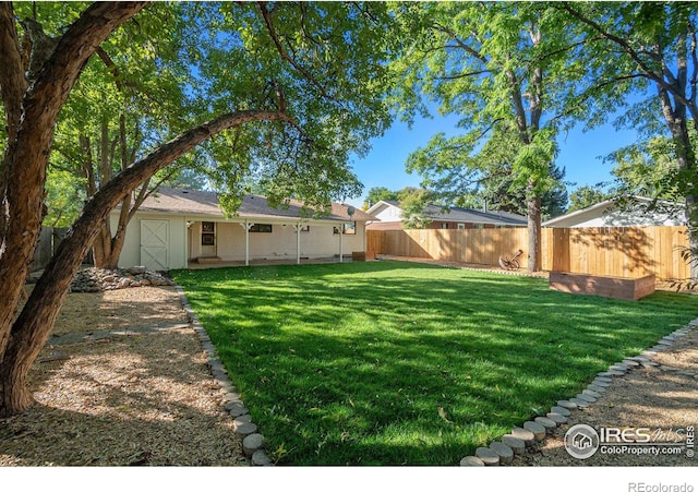 view of yard featuring a fenced backyard