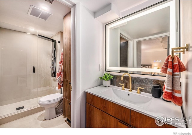 bathroom featuring visible vents, toilet, a shower stall, decorative backsplash, and vanity