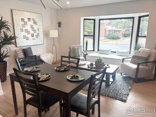 dining area with light wood-style flooring