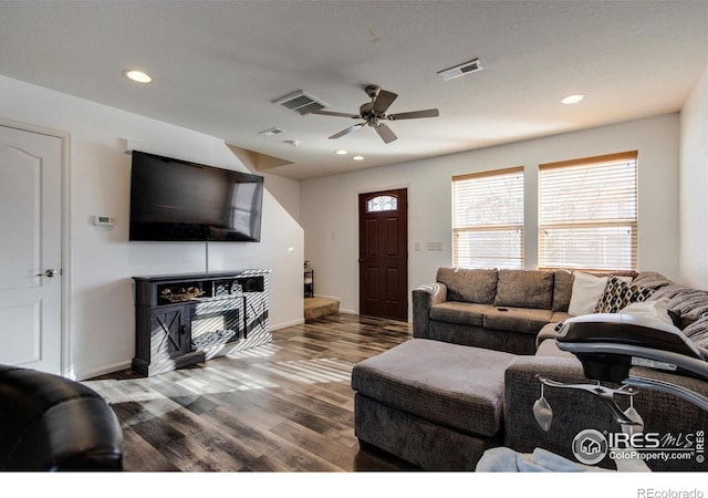 living room featuring hardwood / wood-style flooring and ceiling fan