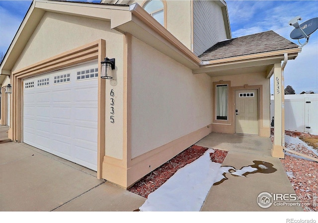 entrance to property featuring a garage