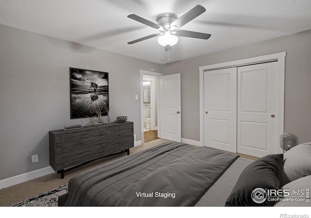 carpeted bedroom with ceiling fan and a closet