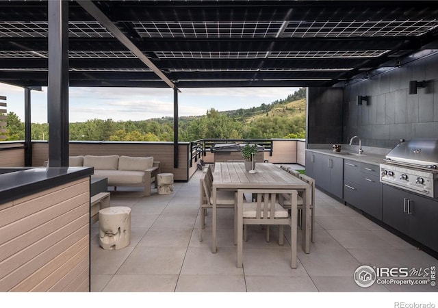 view of patio / terrace featuring area for grilling, an outdoor hangout area, grilling area, and sink