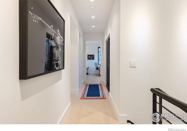 hall with light hardwood / wood-style floors