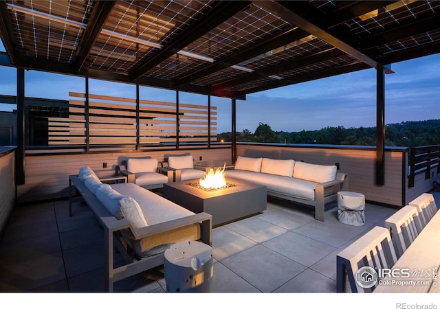 view of patio / terrace featuring an outdoor living space with a fire pit