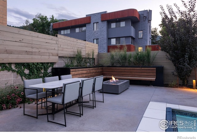 view of patio featuring a fire pit