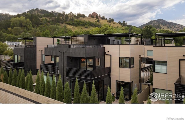 view of building exterior featuring a mountain view