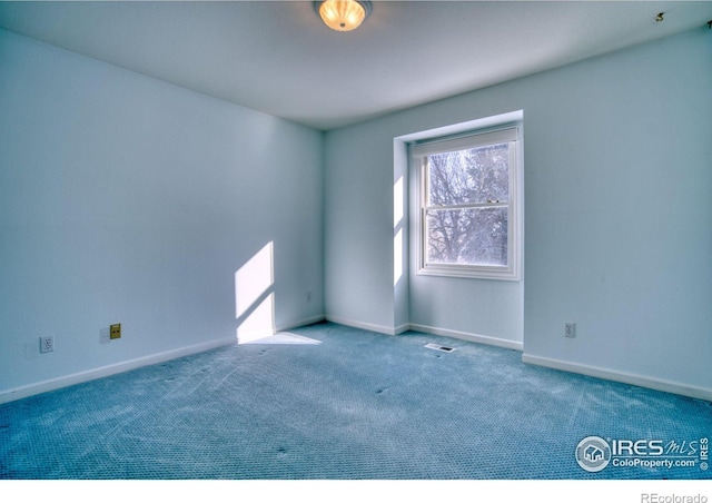 empty room featuring carpet flooring