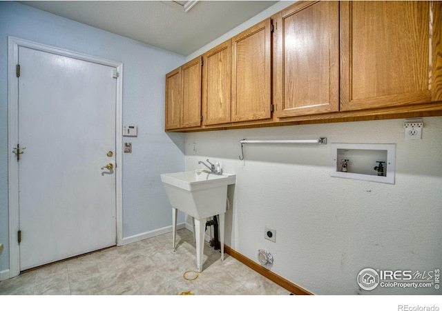 laundry room featuring hookup for a washing machine, cabinets, and hookup for an electric dryer