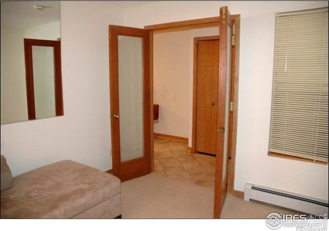 bedroom featuring a baseboard radiator