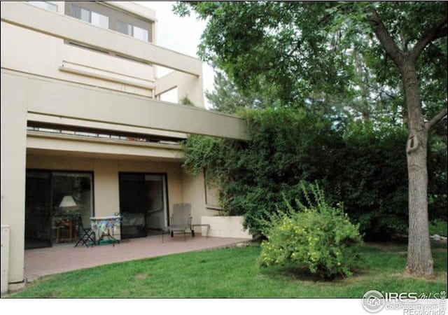 rear view of house featuring a patio area