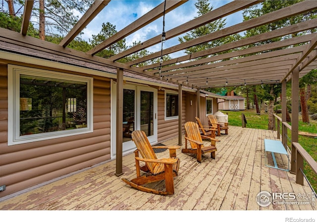 view of patio with a shed and a pergola