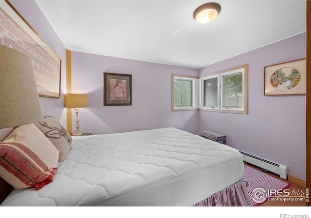 bedroom featuring a baseboard radiator