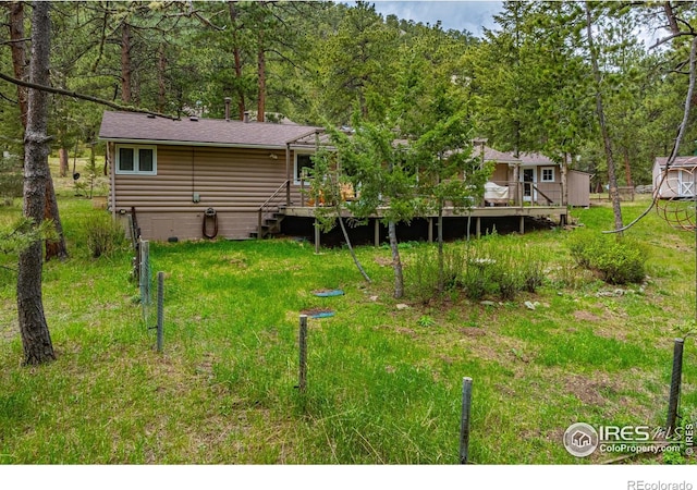 view of yard featuring a wooden deck