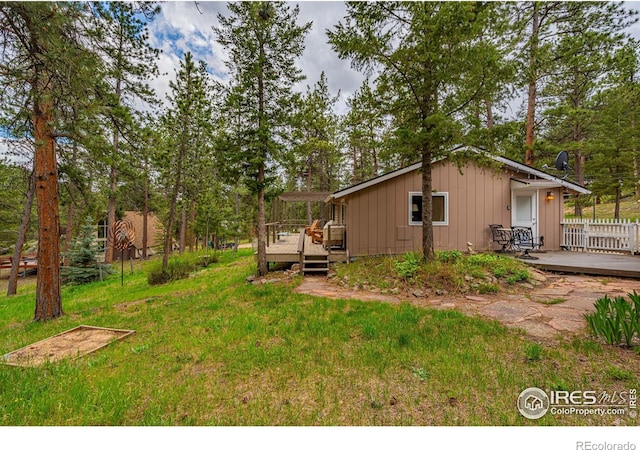 exterior space featuring a yard and a deck