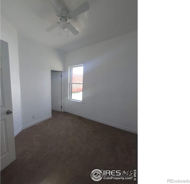 carpeted empty room featuring ceiling fan