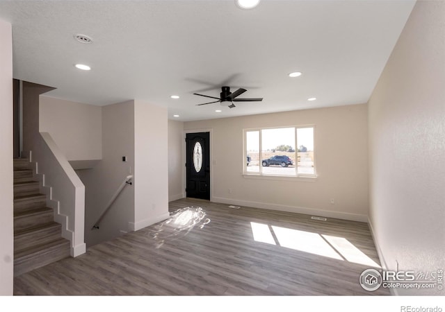 foyer featuring ceiling fan and wood-type flooring