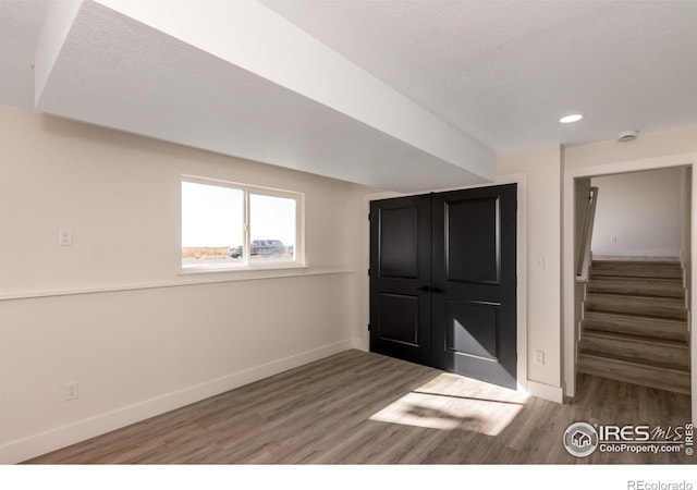 interior space featuring hardwood / wood-style flooring and a textured ceiling